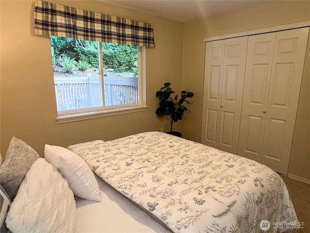 104 Puget Loop, Port Ludlow, WA 98365 - bedroom featuring a closet and carpet flooring
