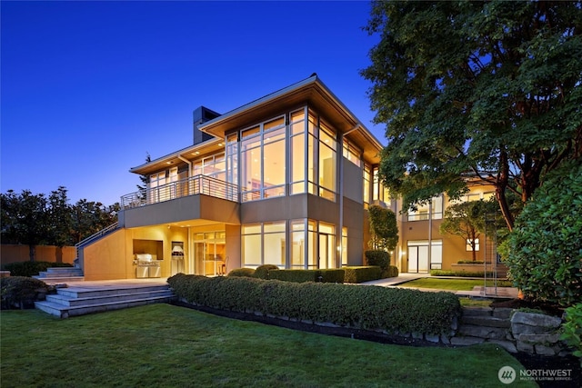5511 104th Ave NE, Kirkland, WA 98033 - rear view of property featuring a balcony, a chimney, stucco siding, and a yard