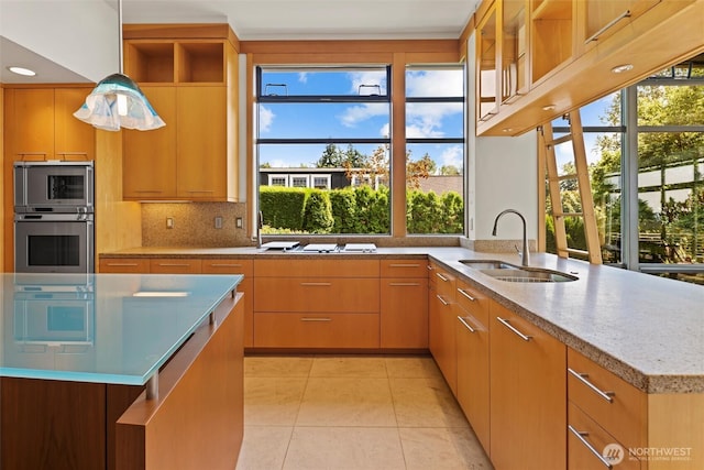 5511 104th Ave NE, Kirkland, WA 98033 - kitchen with stainless steel microwave, open shelves, light tile patterned floors, decorative backsplash, and decorative light fixtures