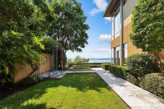 5511 104th Ave NE, Kirkland, WA 98033 - view of green lawn with a water view and a patio
