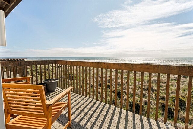 1311 Ocean Shores Blvd SW Unit 5, Ocean Shores, WA 98569 - wooden deck with view of water and beach