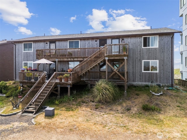 1311 Ocean Shores Blvd SW Unit 5, Ocean Shores, WA 98569 - rear view of property with stairway and a wooden deck