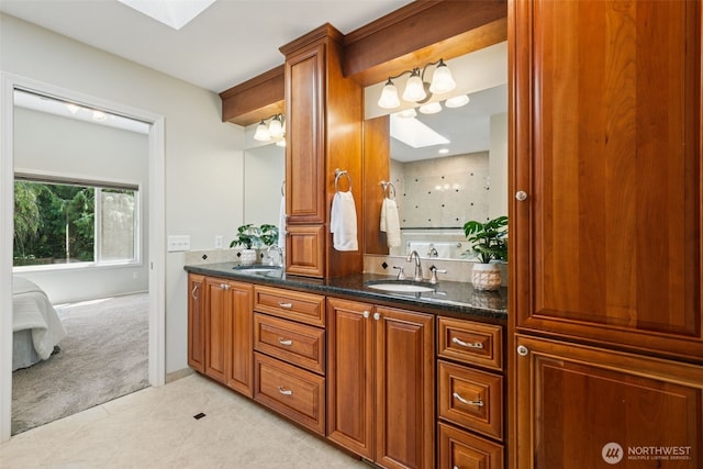 28314 180th Ave SE, Covington, WA 98042 - ensuite bathroom featuring a skylight, double vanity, and tile patterned flooring