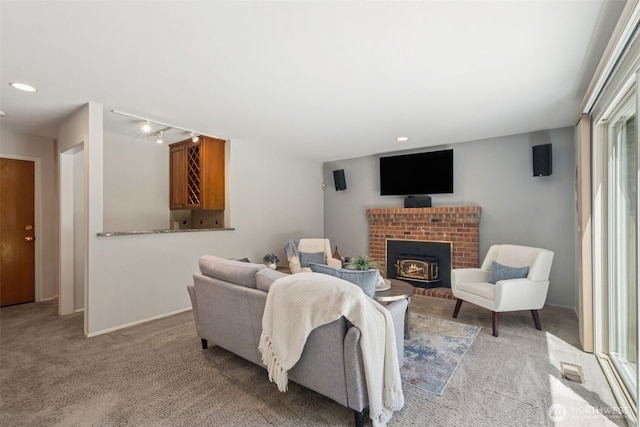 28314 180th Ave SE, Covington, WA 98042 - living area with light carpet, recessed lighting, and a brick fireplace