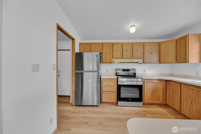 32820 20th Ave S Unit 35, Federal Way, WA 98003 - kitchen with stainless steel appliances, under cabinet range hood, light wood-style floors, and light countertops
