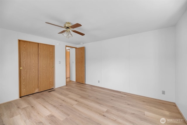 32820 20th Ave S Unit 35, Federal Way, WA 98003 - unfurnished bedroom featuring light wood finished floors, ceiling fan, and a closet