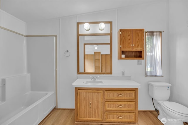 32820 20th Ave S Unit 35, Federal Way, WA 98003 - bathroom with vanity, wood finished floors, and shower / tub combination