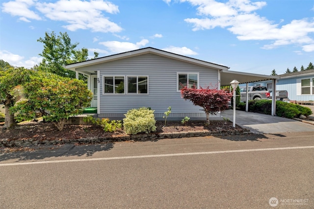 32820 20th Ave S Unit 35, Federal Way, WA 98003 - manufactured / mobile home featuring an attached carport and concrete driveway