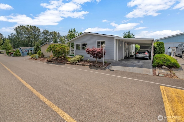 32820 20th Ave S Unit 35, Federal Way, WA 98003 - view of front of property featuring concrete driveway and a carport