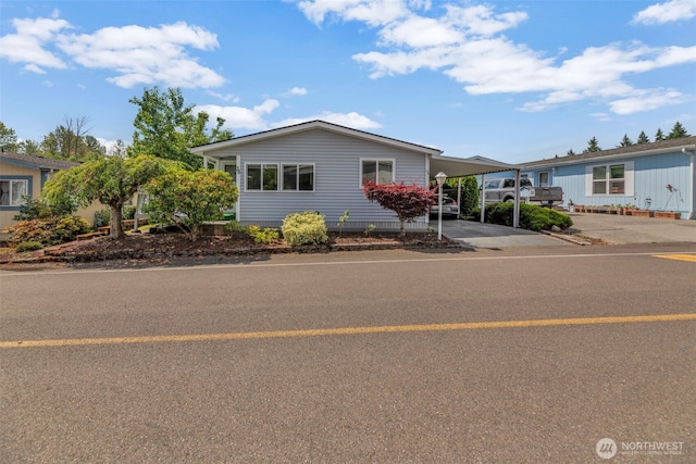 32820 20th Ave S Unit 35, Federal Way, WA 98003 - view of front of house with an attached carport and driveway