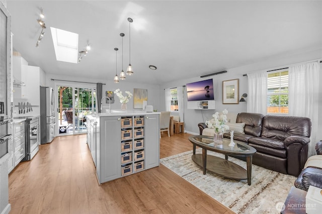 4418 85th Pl SW, Mukilteo, WA 98275 - living area featuring a skylight and light wood finished floors