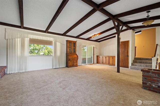 714 Canterbury Rd NW, Soap Lake, WA 98851 - unfurnished living room featuring stairway and carpet flooring