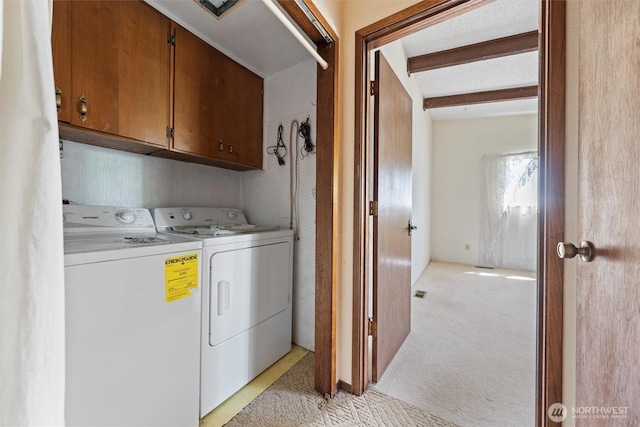 714 Canterbury Rd NW, Soap Lake, WA 98851 - laundry room with washer and clothes dryer, light carpet, and cabinet space