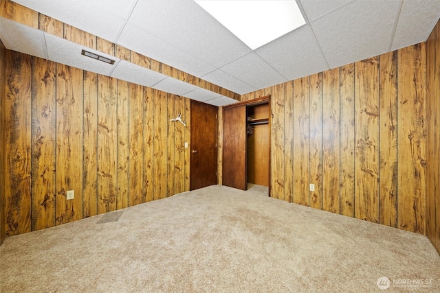 714 Canterbury Rd NW, Soap Lake, WA 98851 - unfurnished room with wood walls and carpet