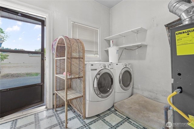 110 3rd Ave SW, Pacific, WA 98047 - laundry area with tile patterned floors, washing machine and dryer, and heating unit