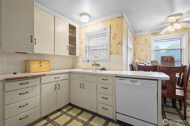 110 3rd Ave SW, Pacific, WA 98047 - kitchen featuring dishwasher, wallpapered walls, light countertops, crown molding, and light flooring