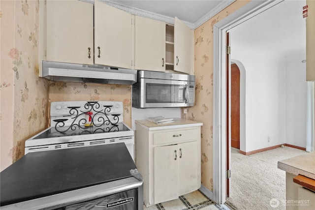 110 3rd Ave SW, Pacific, WA 98047 - kitchen featuring under cabinet range hood, stainless steel microwave, wallpapered walls, white electric range oven, and light countertops