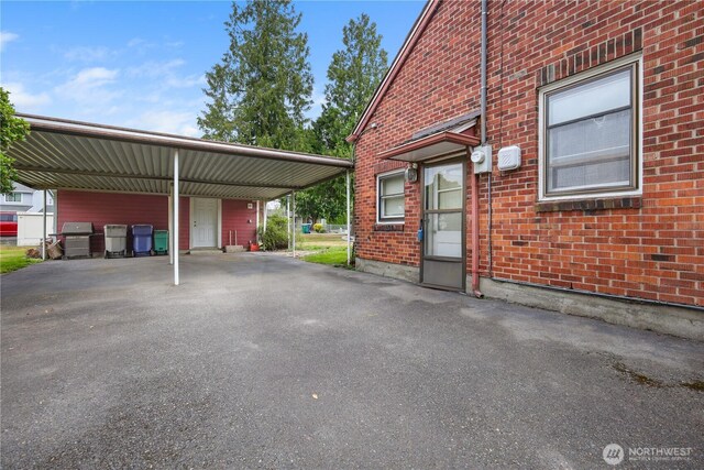 110 3rd Ave SW, Pacific, WA 98047 - view of parking with a carport and driveway