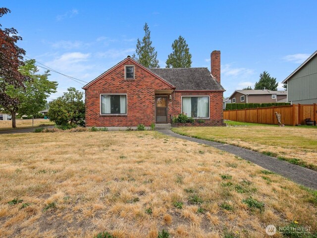 110 3rd Ave SW, Pacific, WA 98047 - view of front of house with brick siding and a chimney