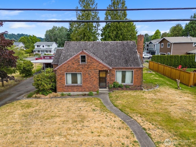 110 3rd Ave SW, Pacific, WA 98047 - view of front of house featuring brick siding, a residential view, and a chimney