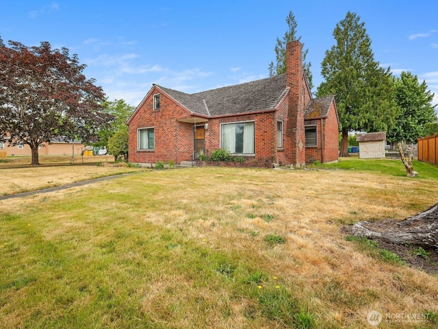 110 3rd Ave SW, Pacific, WA 98047 - view of front of home featuring brick siding and a chimney