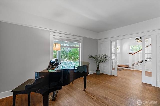 208 N Yakima, Tacoma, WA 98403 - sitting room featuring wood finished floors, stairway, and a chandelier