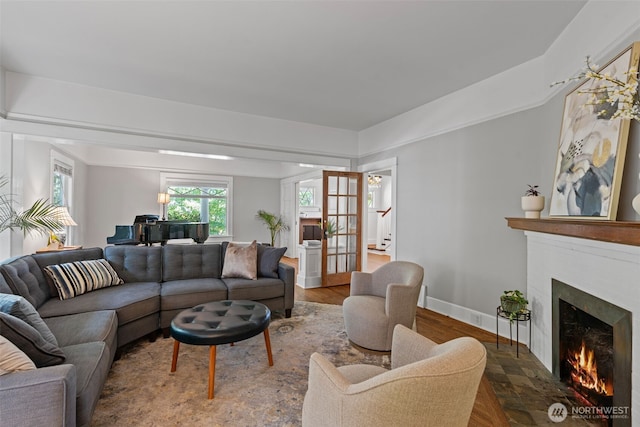 208 N Yakima, Tacoma, WA 98403 - living room with a warm lit fireplace and wood finished floors