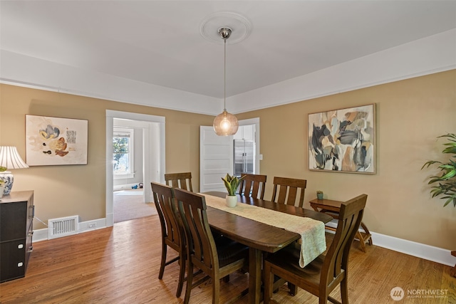 208 N Yakima, Tacoma, WA 98403 - dining area featuring baseboards and light wood-type flooring