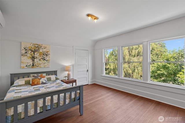 208 N Yakima, Tacoma, WA 98403 - bedroom with multiple windows, wood finished floors, and lofted ceiling