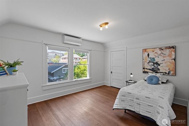 208 N Yakima, Tacoma, WA 98403 - bedroom with a wall unit AC, wood finished floors, and vaulted ceiling
