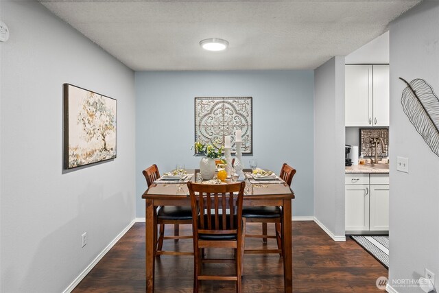 6105 N 16th St Unit N203, Tacoma, WA 98406 - dining room featuring dark wood-style flooring