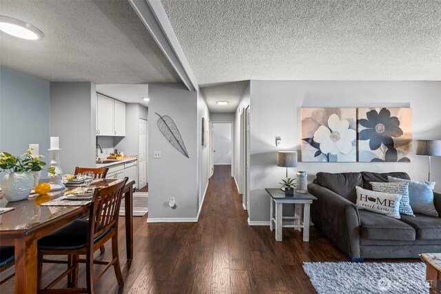 6105 N 16th St Unit N203, Tacoma, WA 98406 - living area with a textured ceiling and dark wood-style flooring