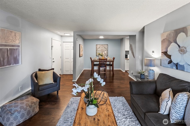 6105 N 16th St Unit N203, Tacoma, WA 98406 - living room featuring dark wood-type flooring and a textured ceiling