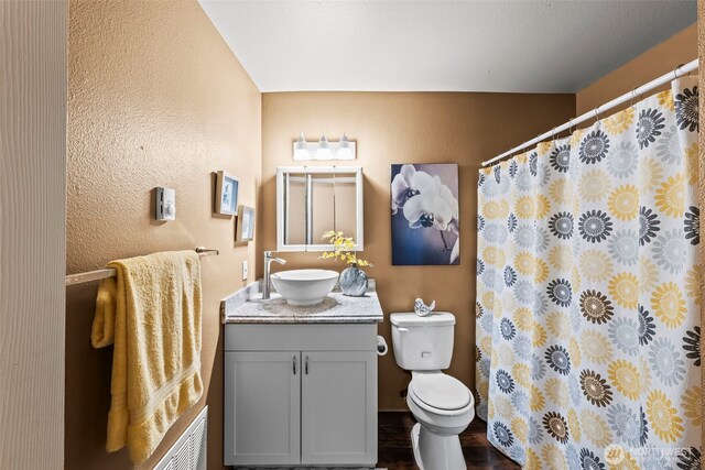 6105 N 16th St Unit N203, Tacoma, WA 98406 - bathroom with vanity, a textured wall, and a shower with curtain