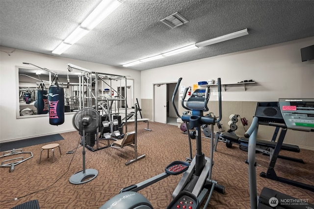 6105 N 16th St Unit N203, Tacoma, WA 98406 - exercise room with a textured ceiling and carpet floors