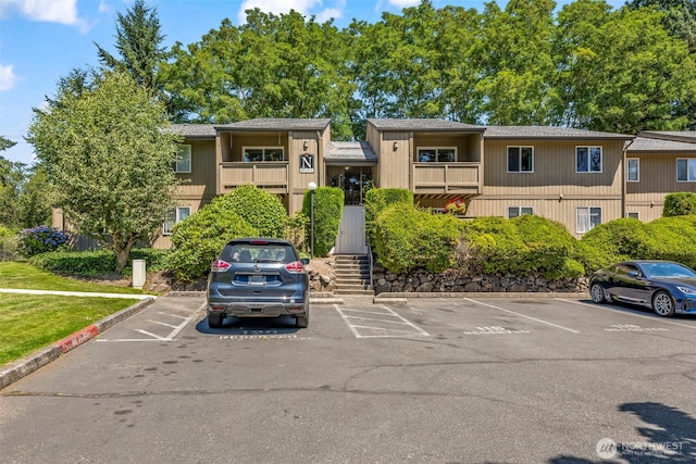 6105 N 16th St Unit N203, Tacoma, WA 98406 - view of building exterior featuring uncovered parking