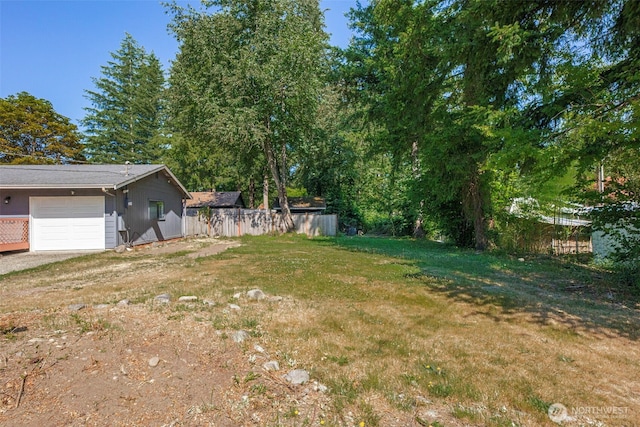 145 7th St, Gold Bar, WA 98251 - view of yard with a garage and driveway