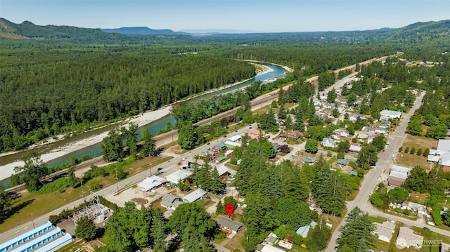 145 7th St, Gold Bar, WA 98251 - aerial view of property and surrounding area with a heavily wooded area and a water and mountain view