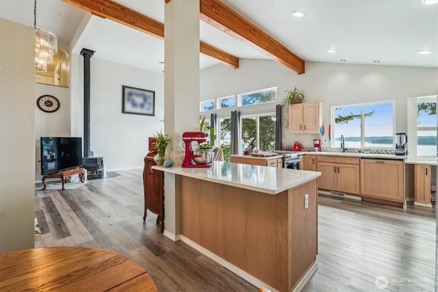 10125 Totem Way, Anderson Island, WA 98303 - kitchen with a peninsula, light wood-style floors, light countertops, recessed lighting, and a kitchen bar