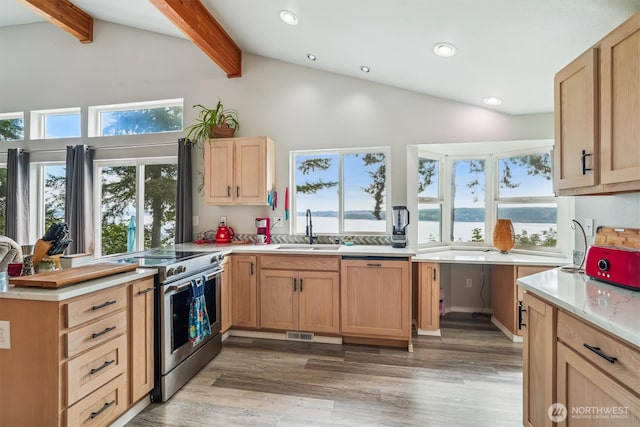 10125 Totem Way, Anderson Island, WA 98303 - kitchen featuring electric range, beam ceiling, light countertops, light brown cabinetry, and recessed lighting