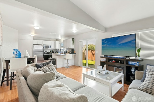 10421 19th Ave SE, Everett, WA 98208 - living area featuring light wood-style flooring and lofted ceiling