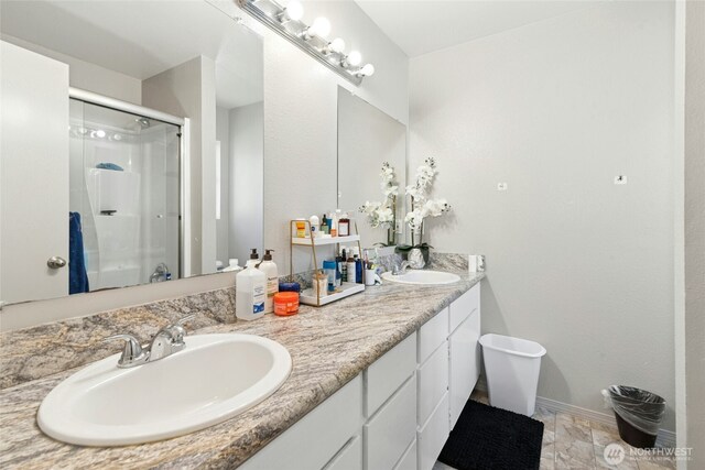 10421 19th Ave SE, Everett, WA 98208 - bathroom featuring a stall shower and double vanity