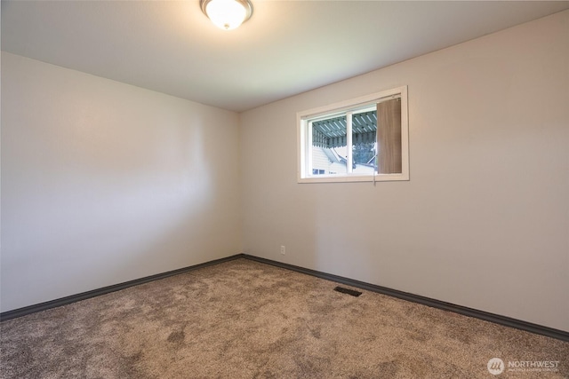 5030 S Park Ave S, Tacoma, WA 98408 - carpeted spare room featuring baseboards
