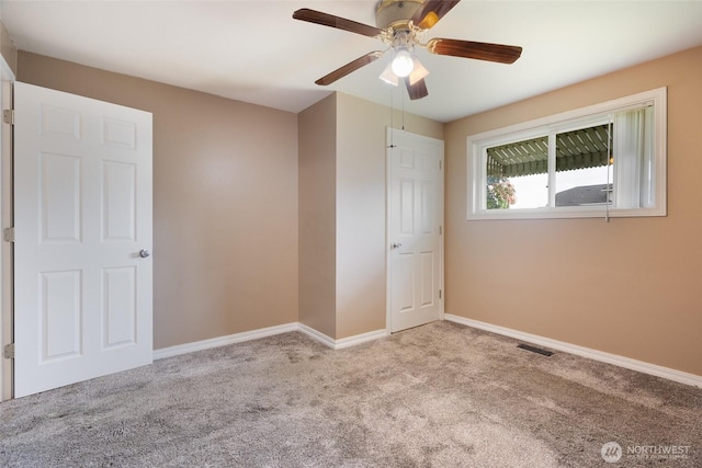 5030 S Park Ave S, Tacoma, WA 98408 - unfurnished bedroom with carpet floors and a ceiling fan