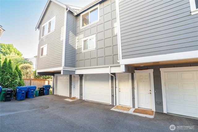 12723 35th Ave NE Unit B, Seattle, WA 98125 - exterior space with an attached garage and driveway