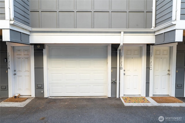 12723 35th Ave NE Unit B, Seattle, WA 98125 - view of exterior entry featuring an attached garage