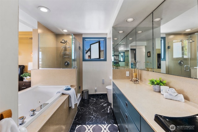 503 12th Ave E, Seattle, WA 98102 - bathroom with marble finish flooring, a shower stall, recessed lighting, a jetted tub, and vanity