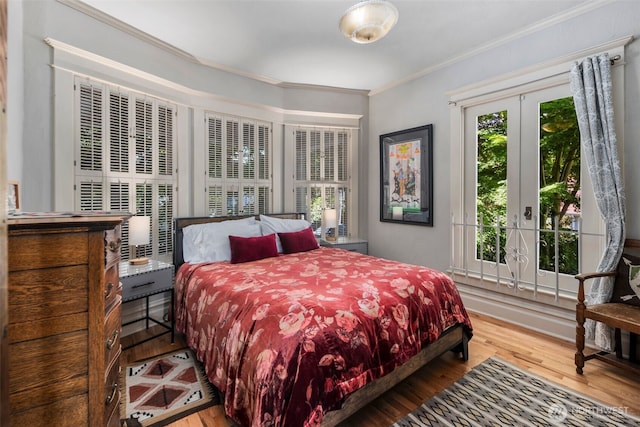 503 12th Ave E, Seattle, WA 98102 - bedroom featuring ornamental molding, wood finished floors, and french doors