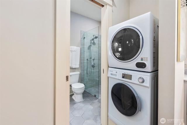 503 12th Ave E, Seattle, WA 98102 - laundry area featuring estacked washer and dryer and tile patterned floors