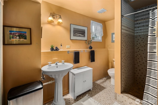 503 12th Ave E, Seattle, WA 98102 - full bath with a stall shower and a wainscoted wall